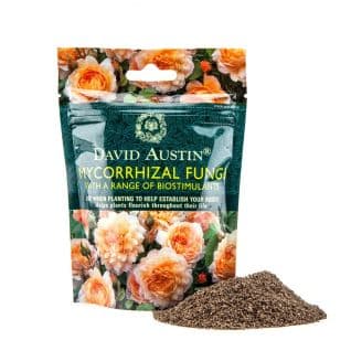 A bag of David Austin Mycorrhizal Fungi next to a pile of the granules